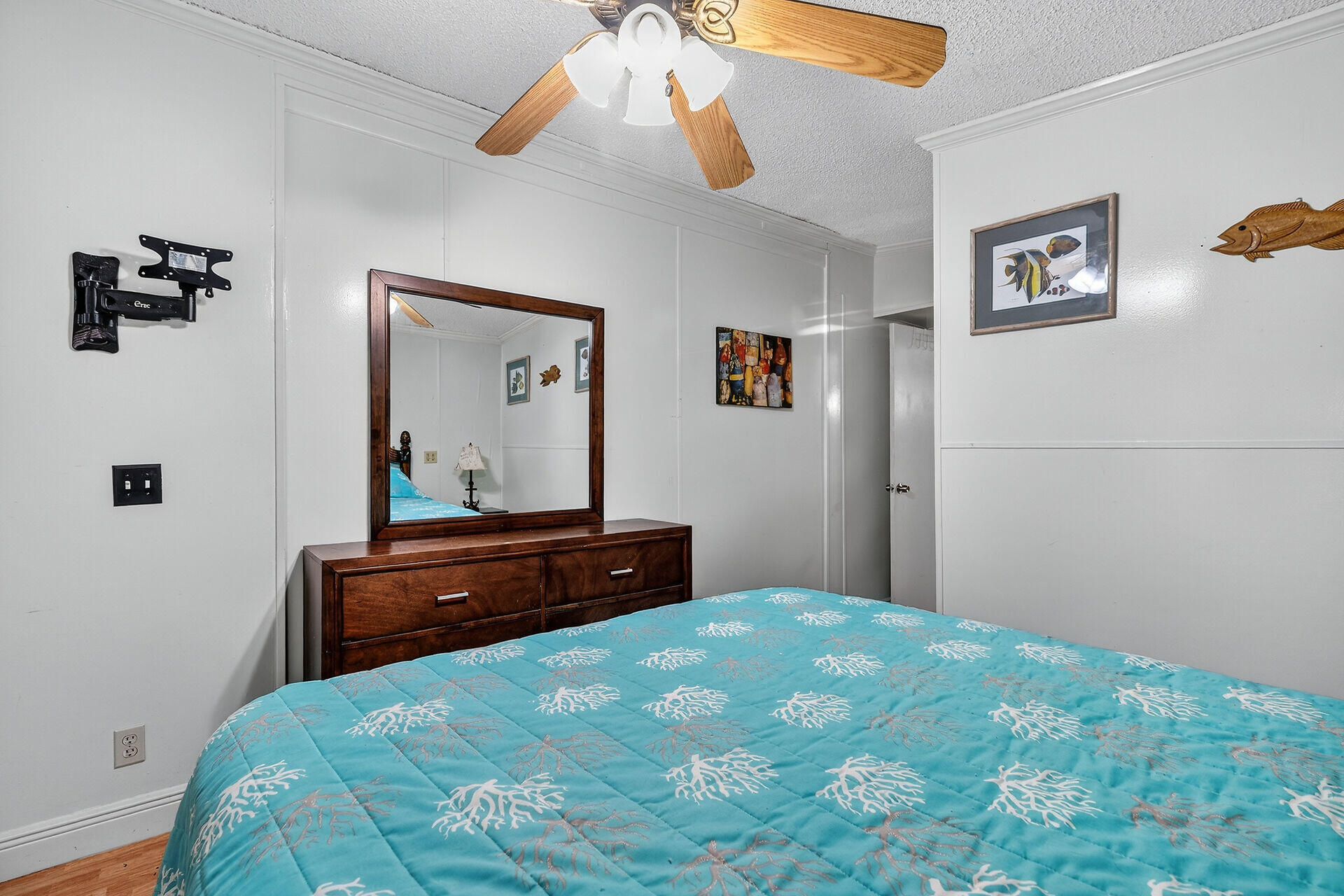 65821 Overseas Highway, Unit 112 Long Key, FL 33001 - Photo 21 of 49 a bedroom with a bed and a chandelier