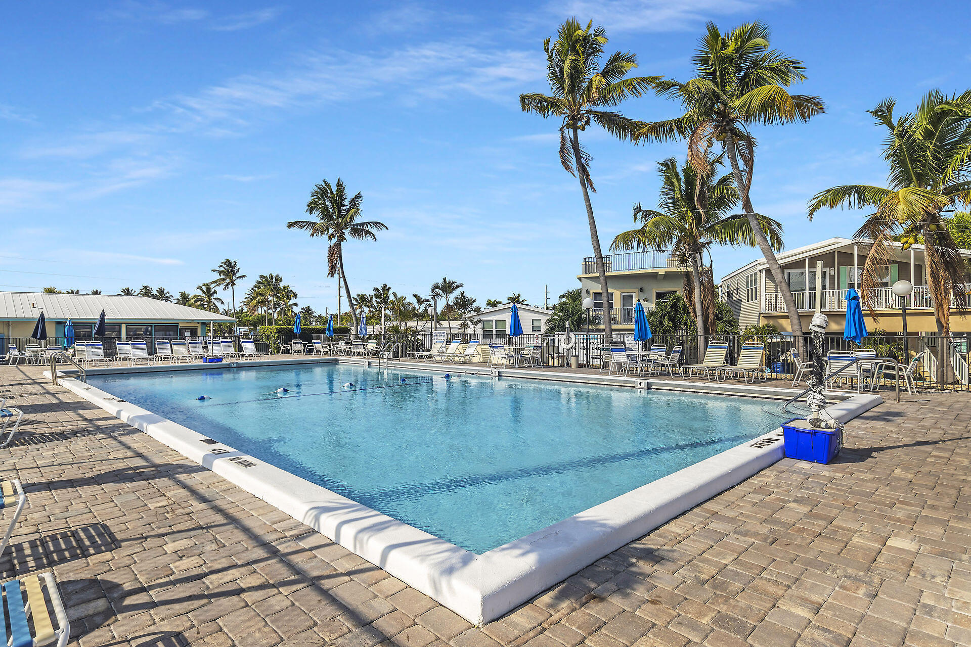 65821 Overseas Highway, Unit 112 Long Key, FL 33001 - Photo 3 of 49 a view of a swimming pool with a lounge chairs