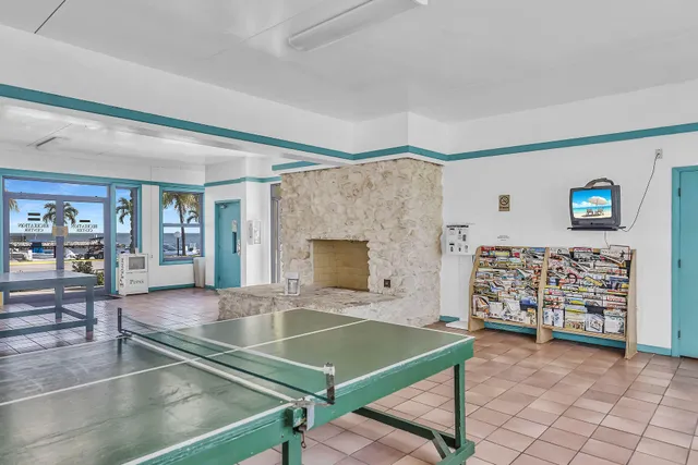 a dining room with furniture and a book shelf