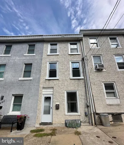 a front view of a house with parking