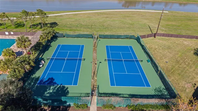 an aerial view of a house with a yard and potted plants