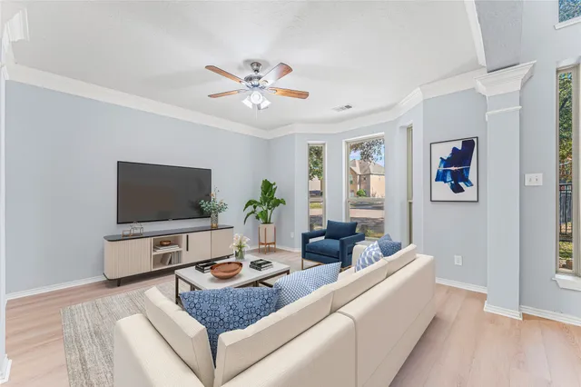 a living room with furniture and a flat screen tv