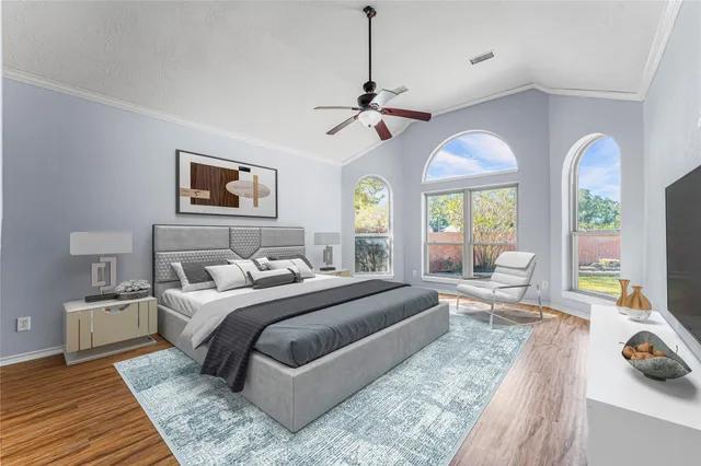 a large bedroom with a large bed and a couch