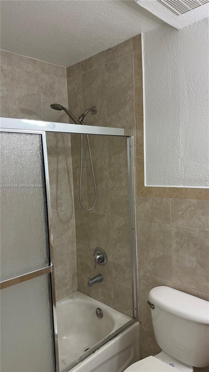 3901 Southwest 109th Avenue, Unit 4 Miami, FL 33165 - Photo 10 of 15 a bathroom with a toilet and a shower