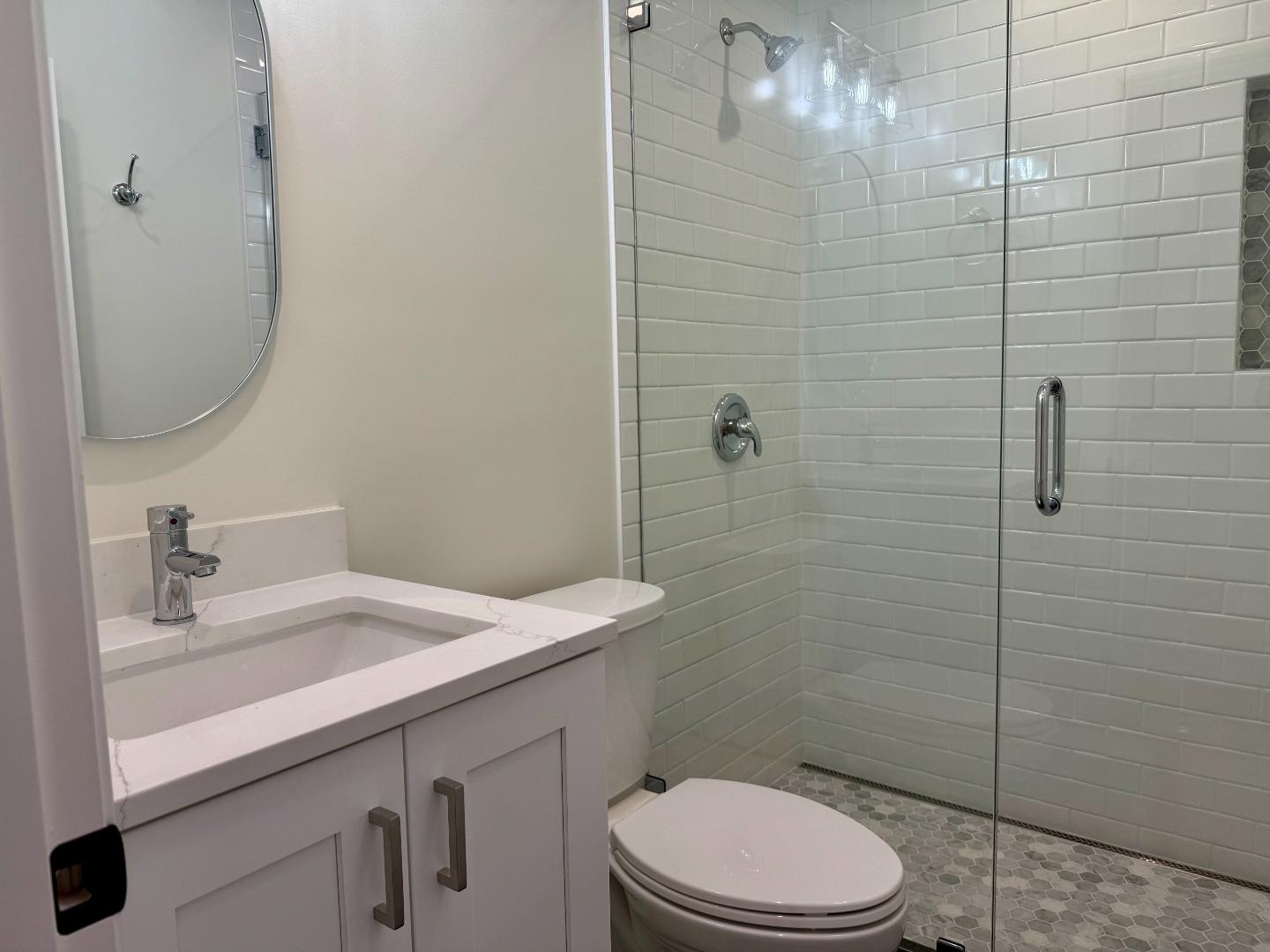 634 Fulton Street Redwood City, CA 94061 - Photo 19 of 24 a bathroom with a sink a toilet and shower