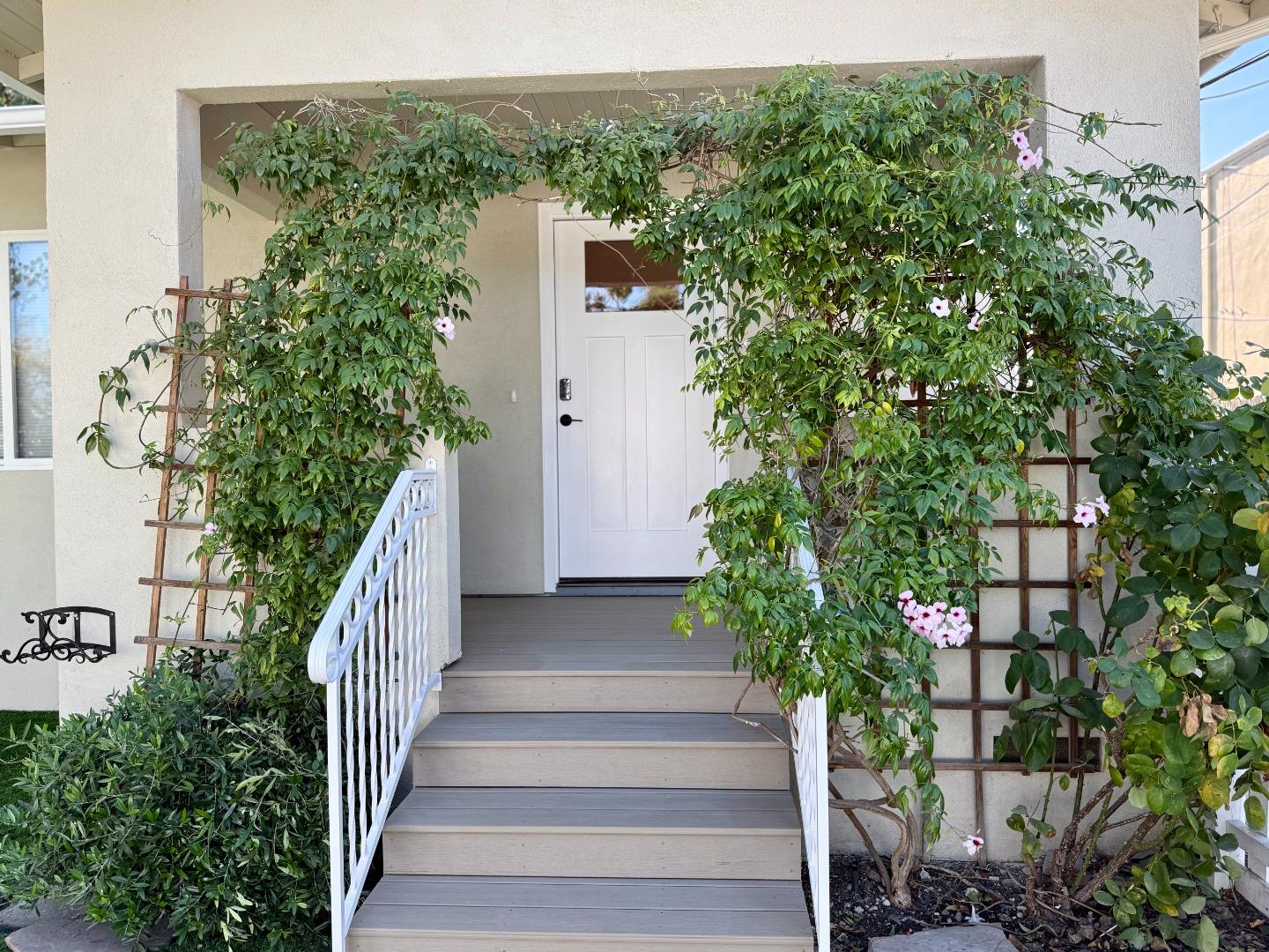 634 Fulton Street Redwood City, CA 94061 - Photo 5 of 24 a view of a house with a tree