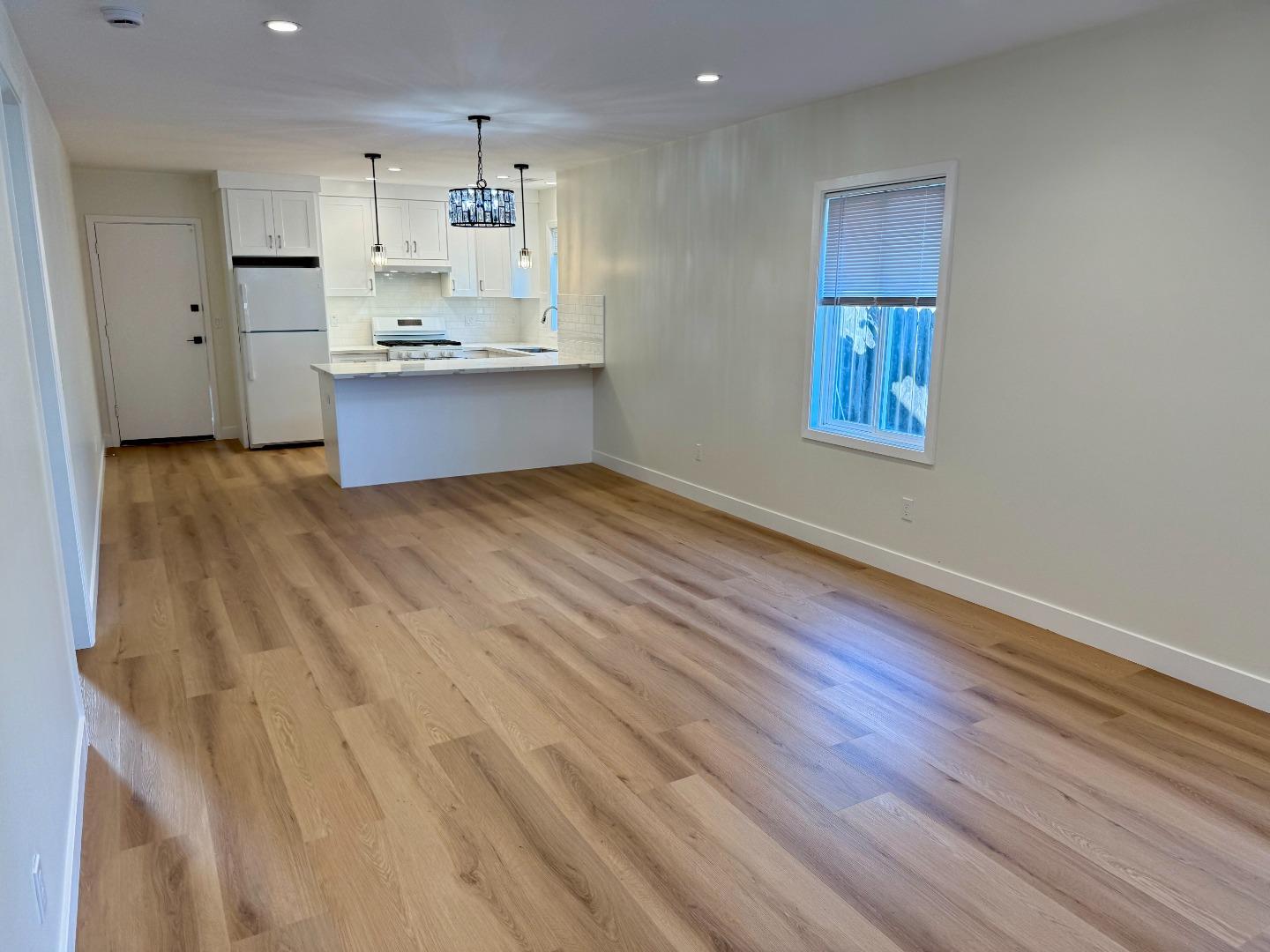 634 Fulton Street Redwood City, CA 94061 - Photo 8 of 24 a view of kitchen and wooden floor
