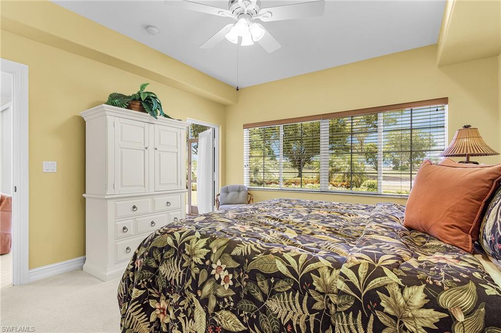 9113 Michael Circle, Unit 7 Naples, FL 34113 - Photo 20 of 34 a bed sitting in a bedroom next to a window