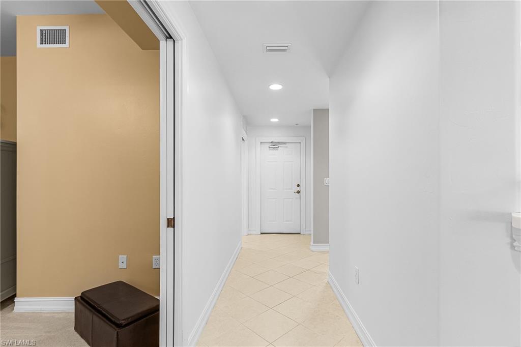 9113 Michael Circle, Unit 7 Naples, FL 34113 - Photo 7 of 34 a bathroom with a sink and a mirror