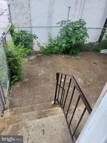a view of backyard with sitting area