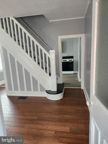a view of entryway with wooden floor