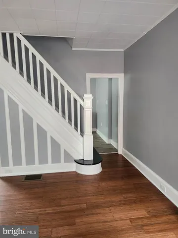 a view of entryway with wooden floor