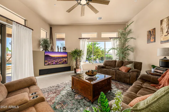 a kitchen with granite countertop wooden cabinets and a refrigerator