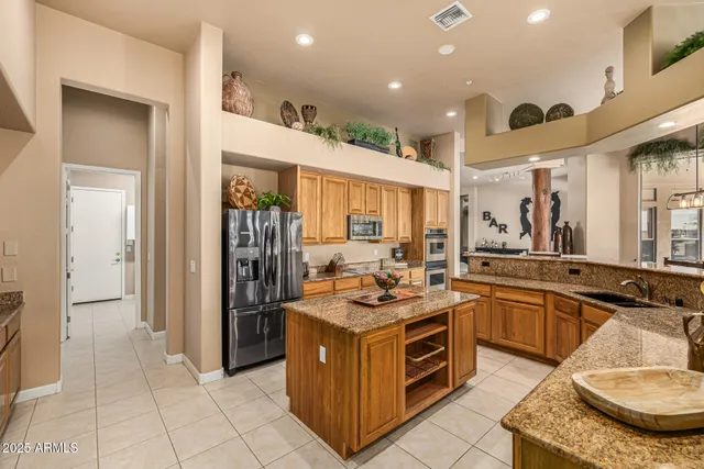 a bedroom with furniture and a chandelier