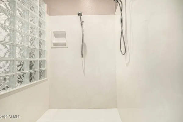 a view of a house with pool and sitting area