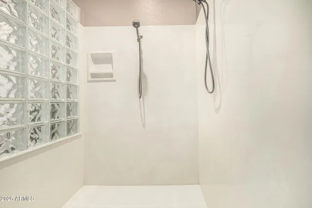 a view of a house with pool and sitting area