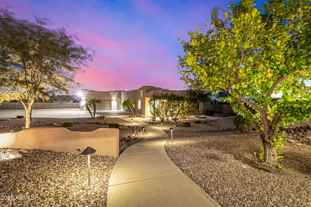 a lobby with furniture and a large mirror