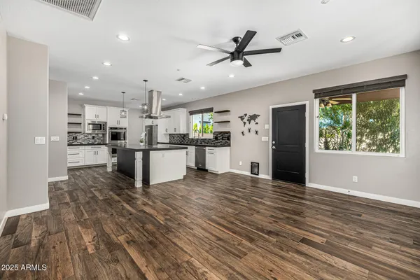 a view of a swimming pool with a patio