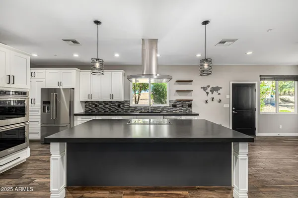 a view of swimming pool with outdoor seating and plants