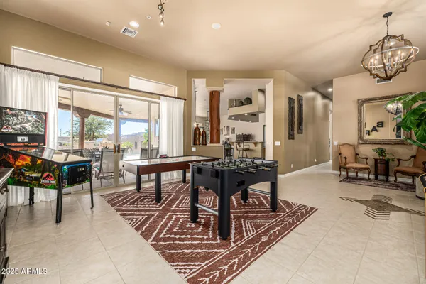 a kitchen with stainless steel appliances granite countertop a sink a counter top space appliances and cabinets