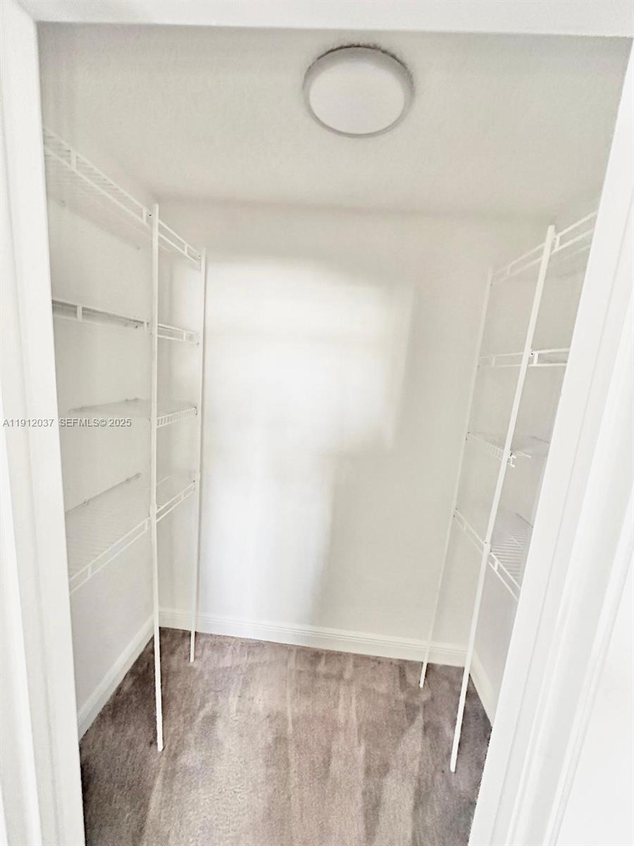 8632 Northwest 34th Place, Unit C207 Sunrise, FL 33351 - Photo 13 of 19 a view of small space with wooden floor