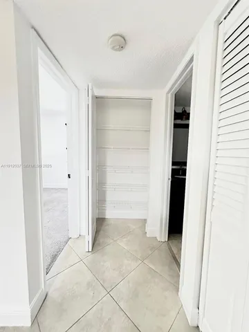 a view of a playground with basketball court