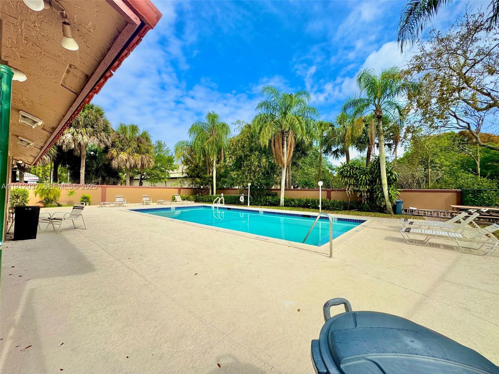 8632 Northwest 34th Place, Unit C207 Sunrise, FL 33351 - Photo 17 of 19 a view of a playground with basketball court