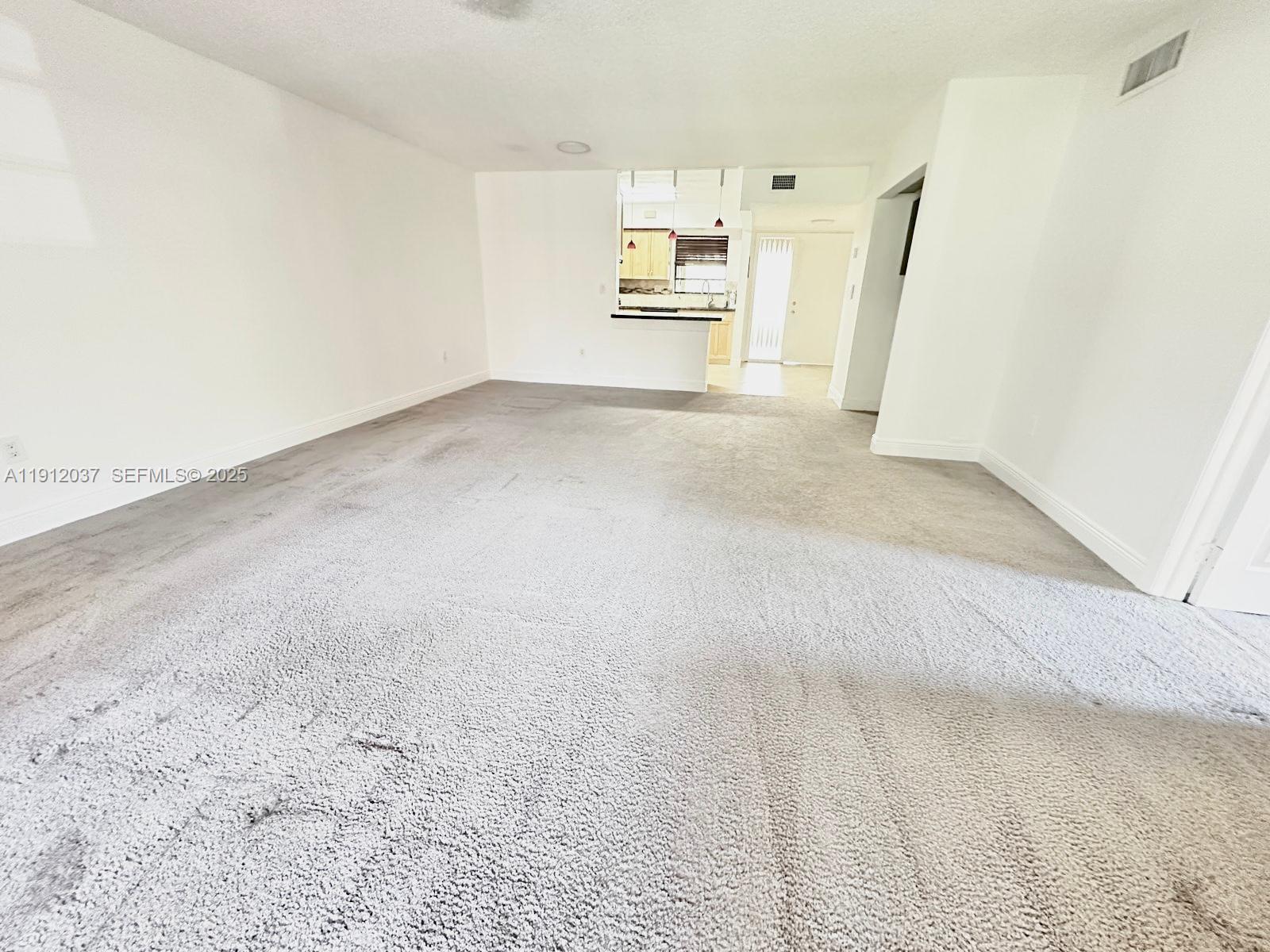 8632 Northwest 34th Place, Unit C207 Sunrise, FL 33351 - Photo 8 of 19 a view of a kitchen with refrigerator and a sink