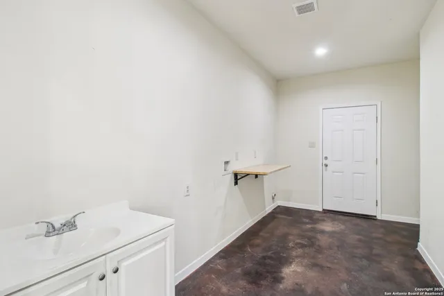 a bathroom with a sink vanity and a mirror