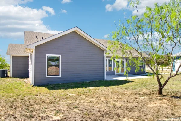 a view of a livingroom with an empty space and a window