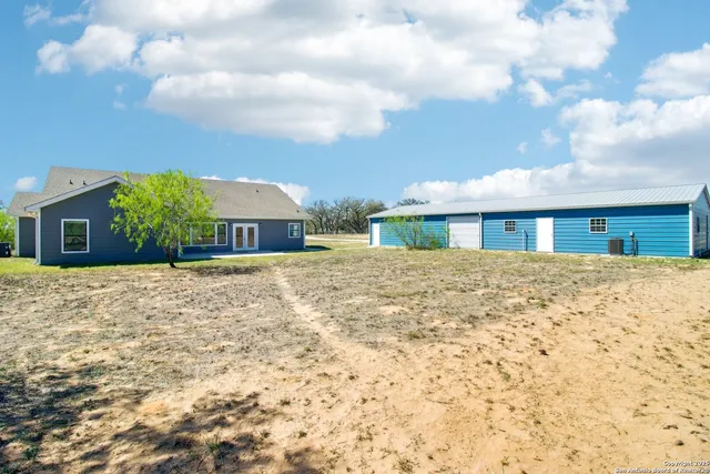 a view of a room with furniture and a window