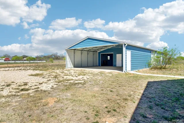 a view of a room with a wooden door