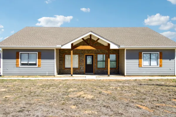a front view of a house with a ocean view