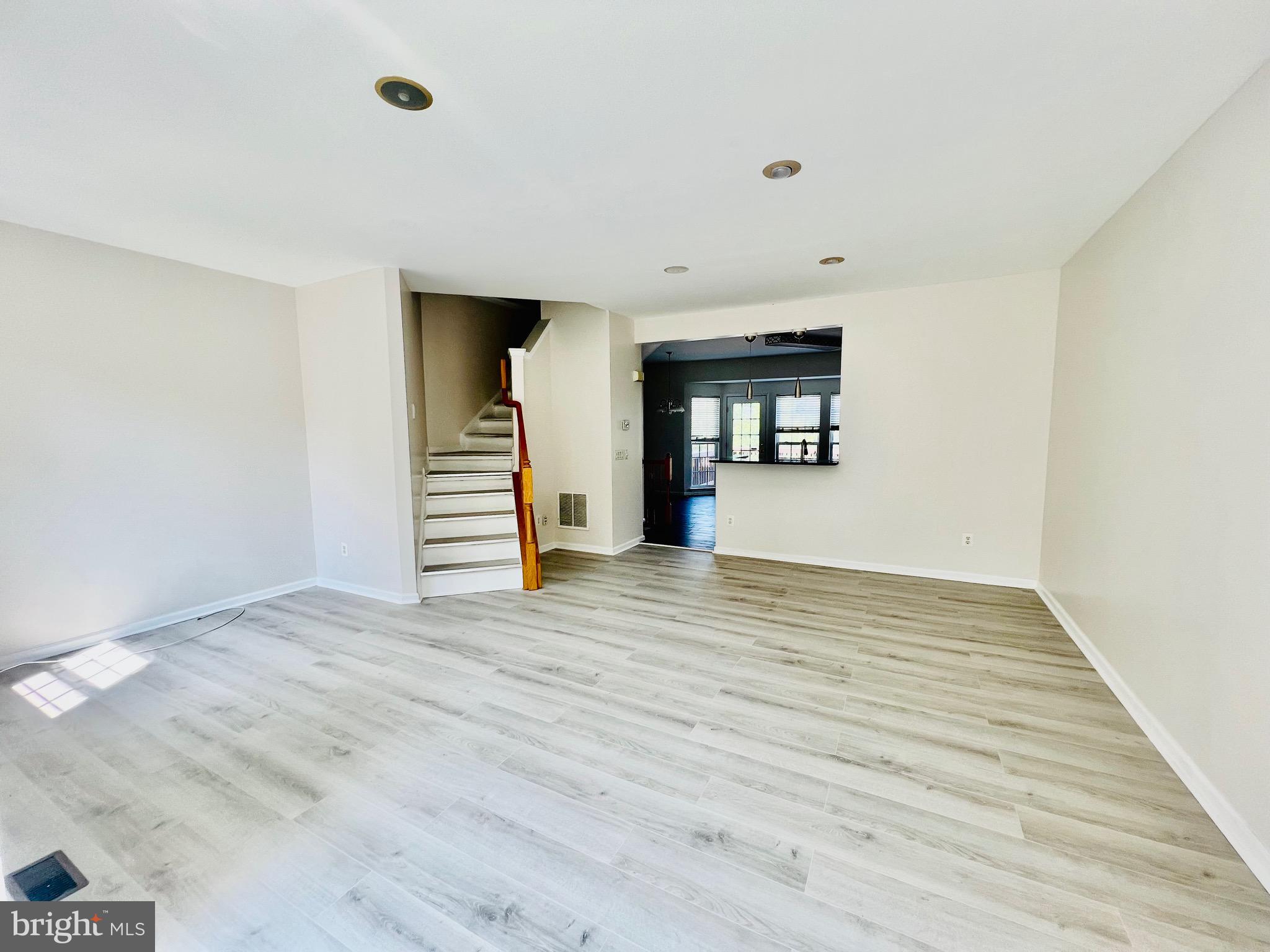 13251 Revillo Loop Woodbridge, VA 22191 - Photo 16 of 32 a view of empty room with wooden floor and window