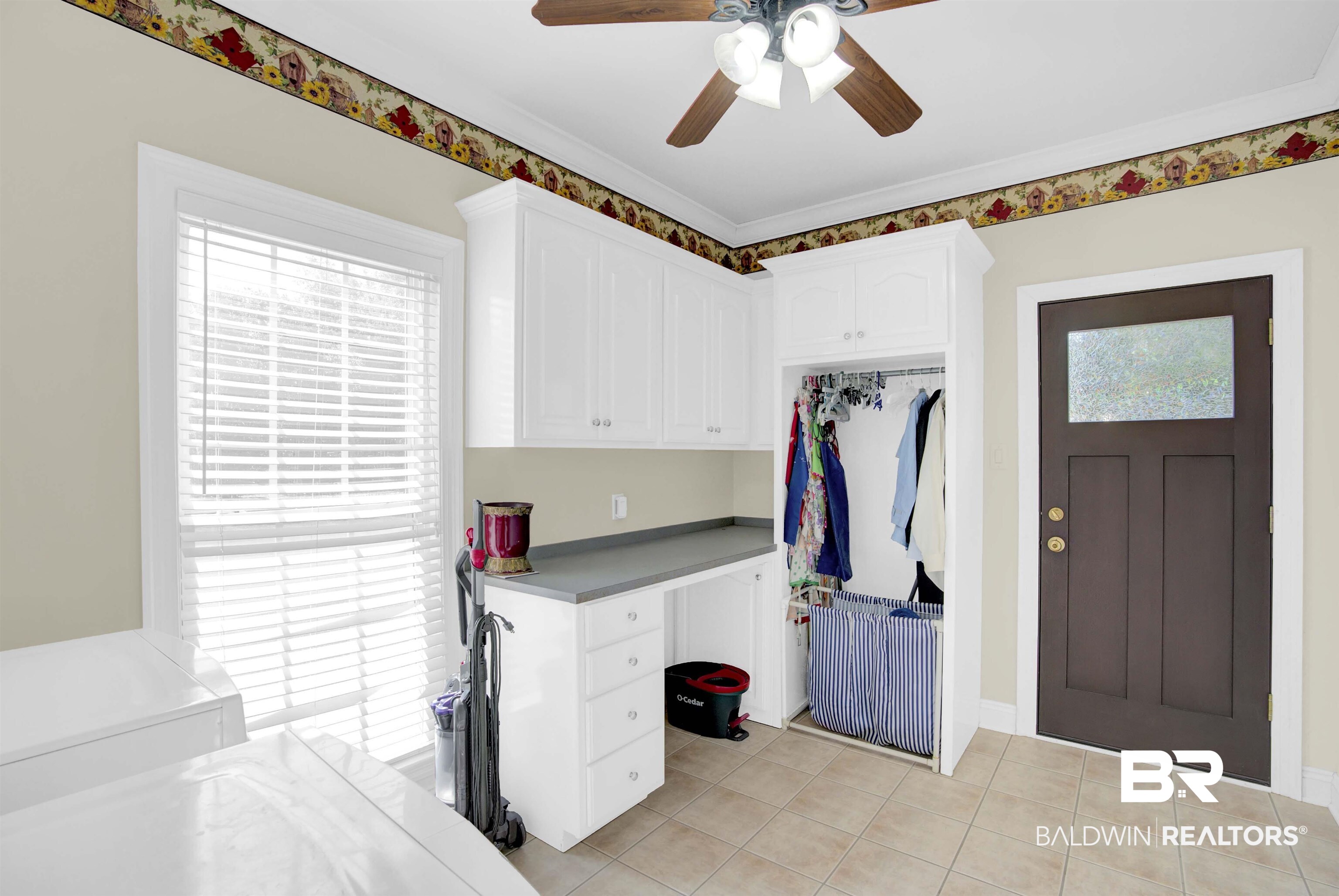 27688 Rigsby Road Daphne, AL 36526 - Photo 24 of 56 Interior space with ceiling fan, cabinets, light tile patterned floors, and a wealth of natural light