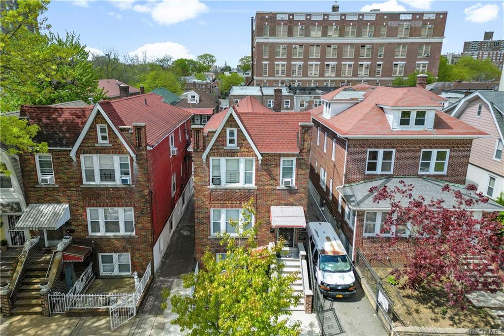 a aerial view of a residential apartment building with a yard