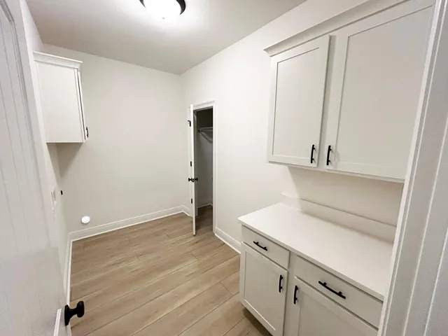 a view of storage and utility room with closet