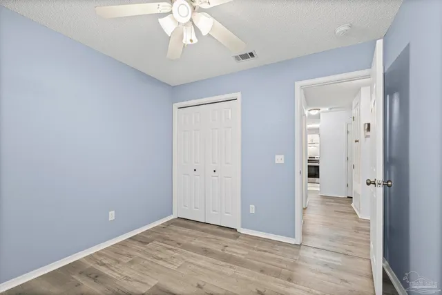 wooden floor in an empty room with a mirror