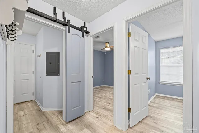 a bathroom with a granite countertop toilet a sink and a large mirror
