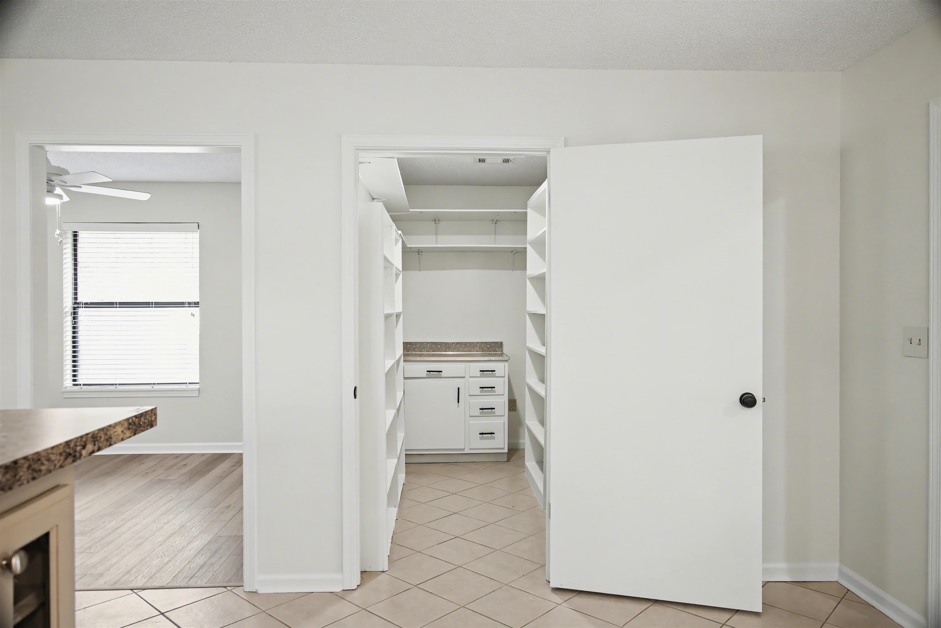632 Cullum Road Munford, TN 38058 - Photo 11 of 38 Walk in closet with beverage cooler, light tile patterned floors, and ceiling fan