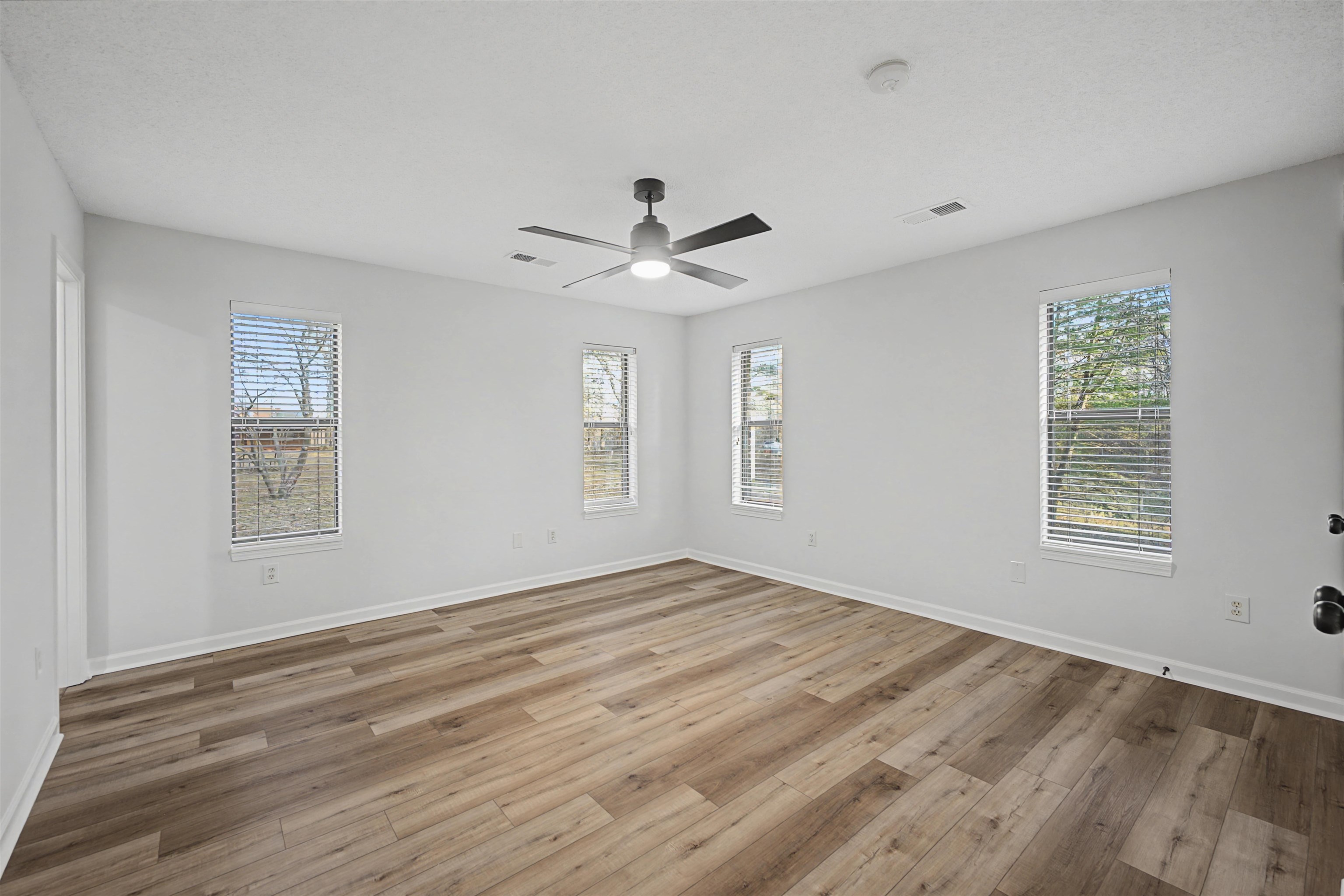 632 Cullum Road Munford, TN 38058 - Photo 21 of 38 Unfurnished room with light wood-type flooring and a ceiling fan