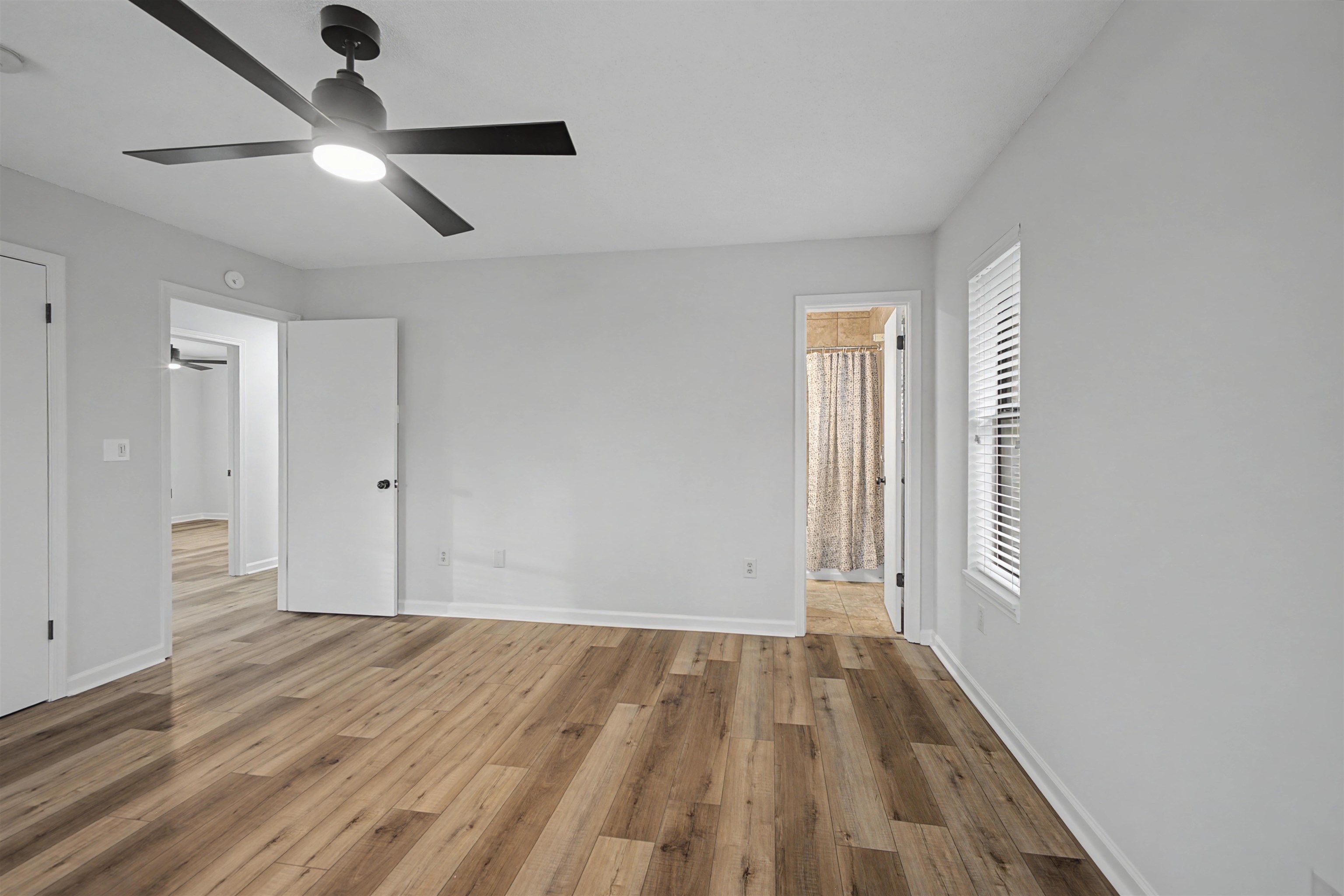 632 Cullum Road Munford, TN 38058 - Photo 23 of 38 Unfurnished bedroom featuring hardwood / wood-style floors, a ceiling fan, and ensuite bathroom