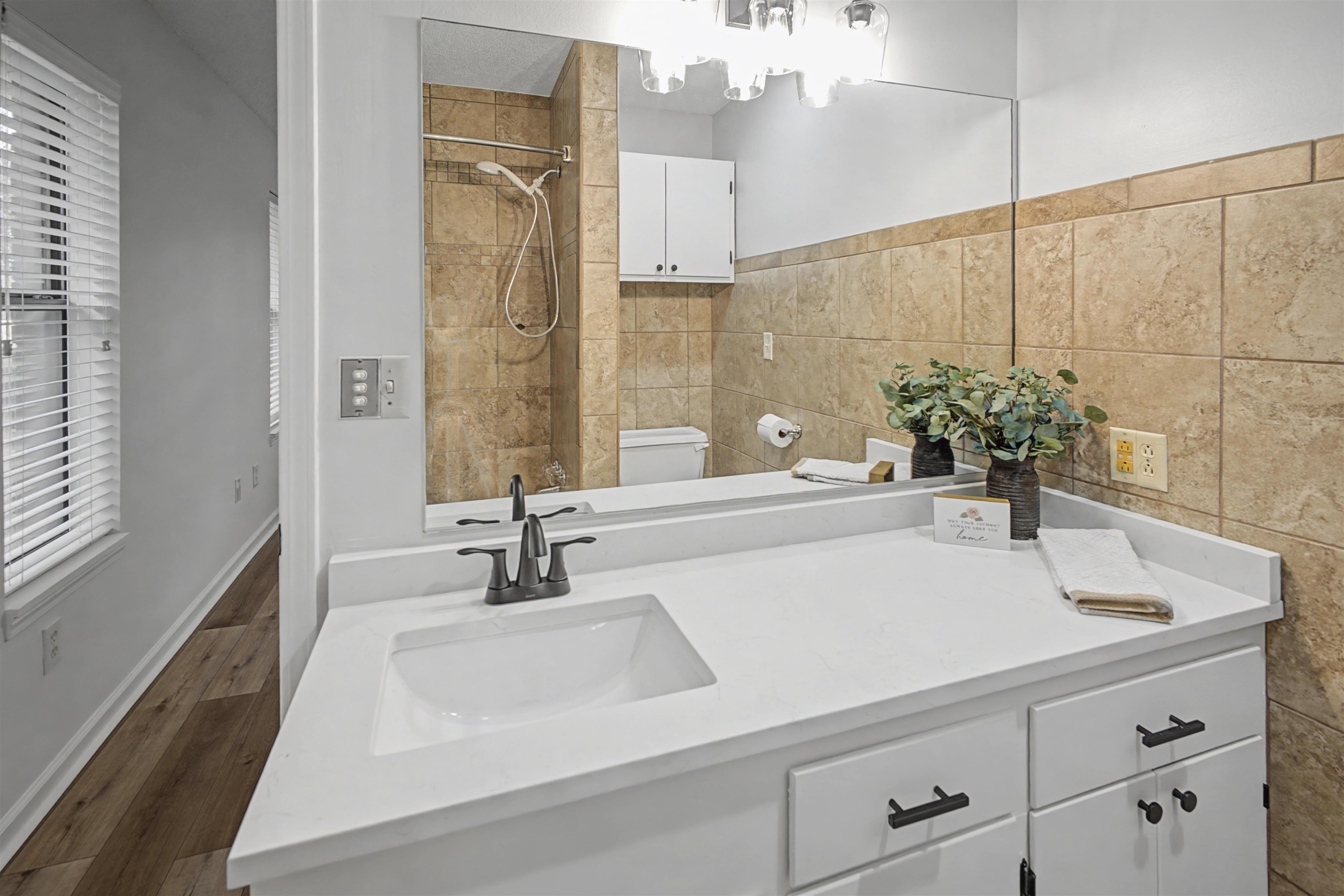 632 Cullum Road Munford, TN 38058 - Photo 26 of 38 Full bathroom featuring vanity, tiled shower, tile walls, and wood finished floors