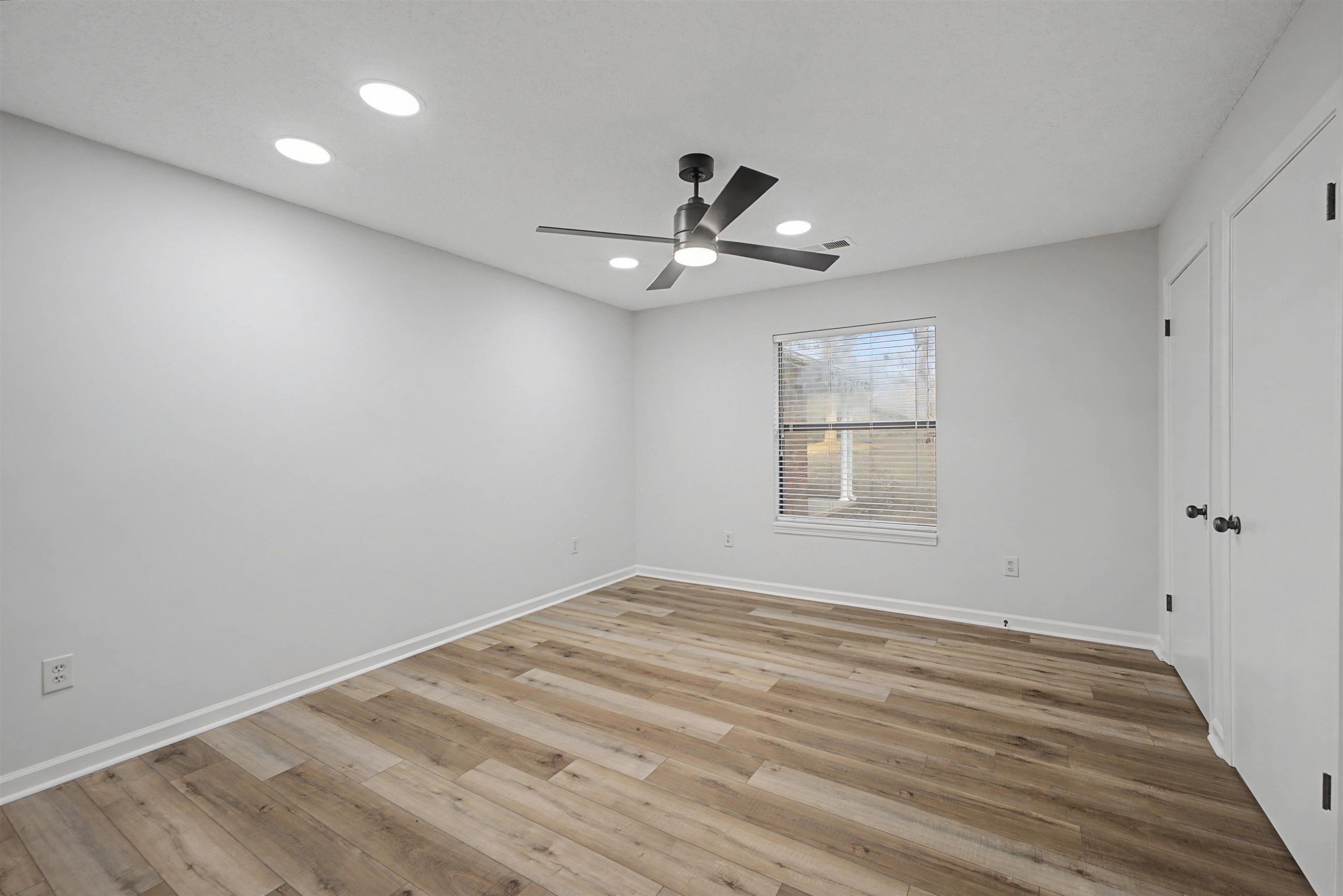 632 Cullum Road Munford, TN 38058 - Photo 29 of 38 Unfurnished room with light wood finished floors, ceiling fan, and recessed lighting