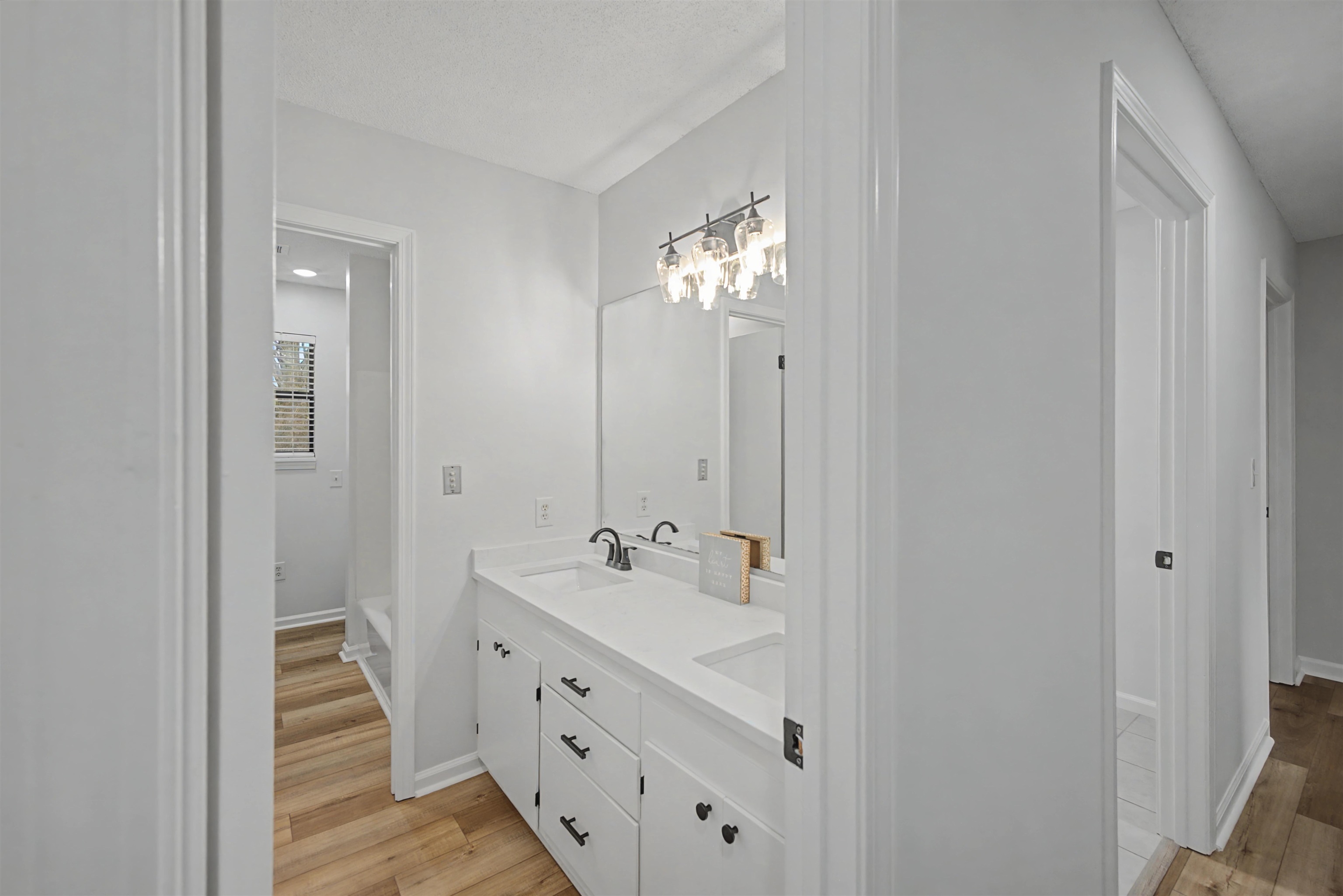 632 Cullum Road Munford, TN 38058 - Photo 33 of 38 Full bathroom featuring double vanity and light wood finished floors