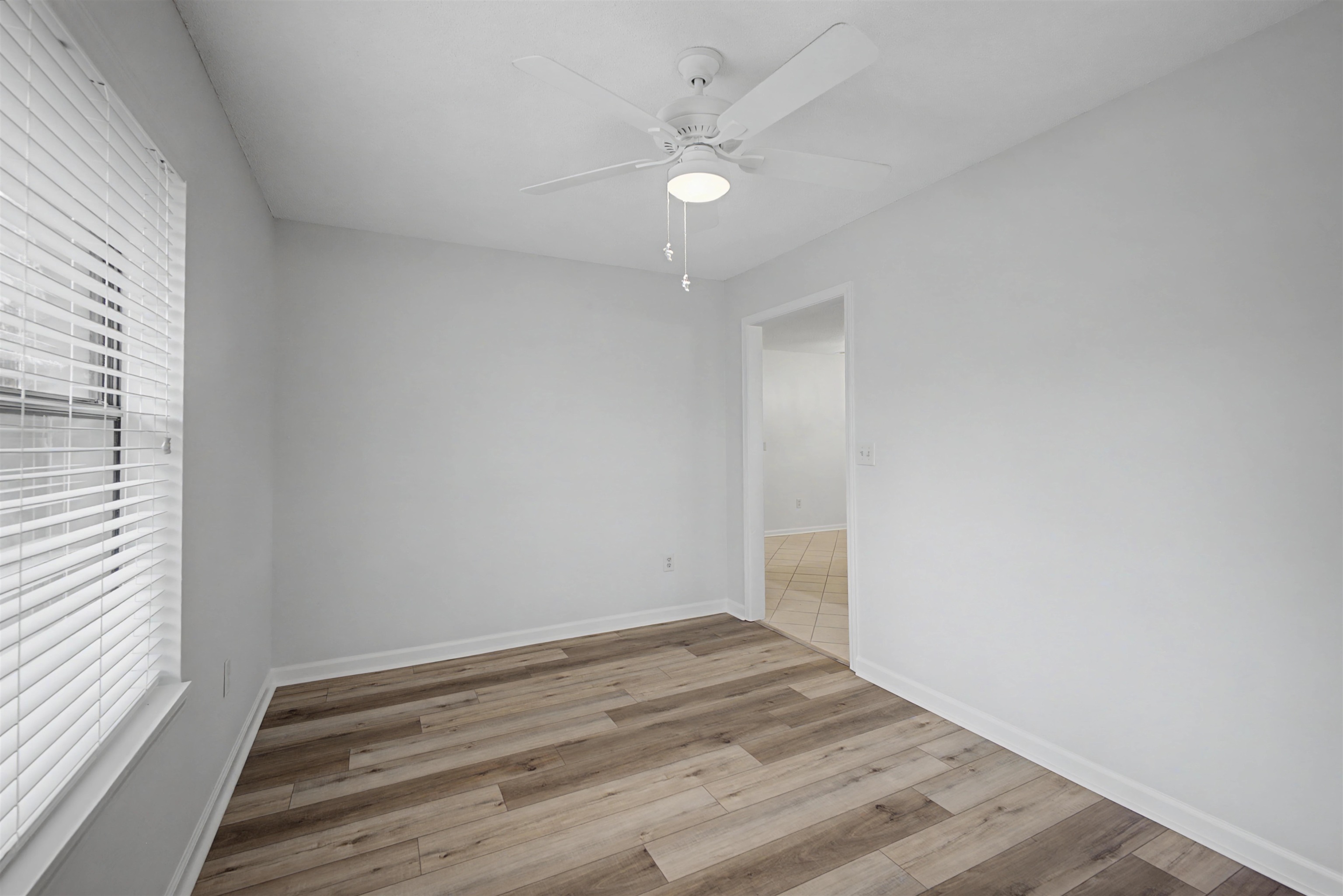 632 Cullum Road Munford, TN 38058 - Photo 38 of 38 Unfurnished room with light wood-style flooring and a ceiling fan