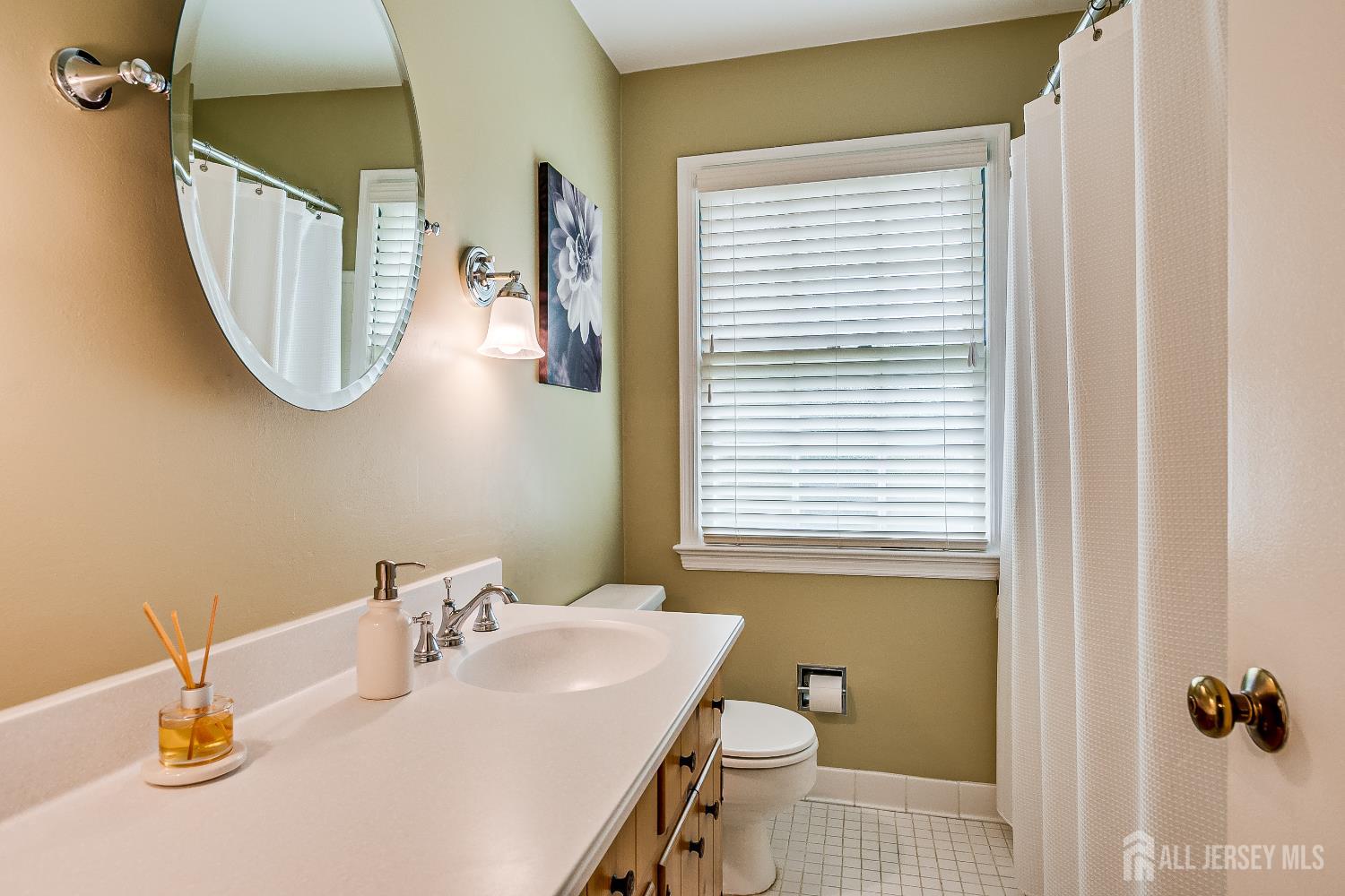 240 Dwight Road Middletown, NJ 07748 - Photo 21 of 28 a bathroom with a sink toilet and a mirror