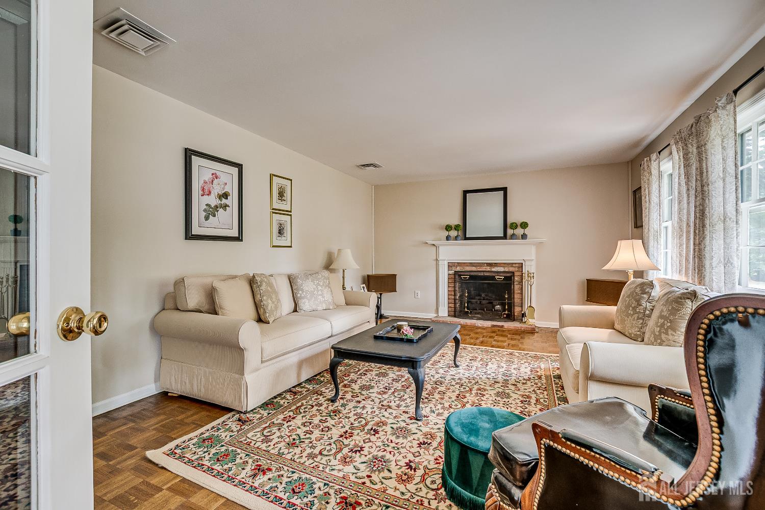 240 Dwight Road Middletown, NJ 07748 - Photo 3 of 28 a living room with furniture and a fireplace