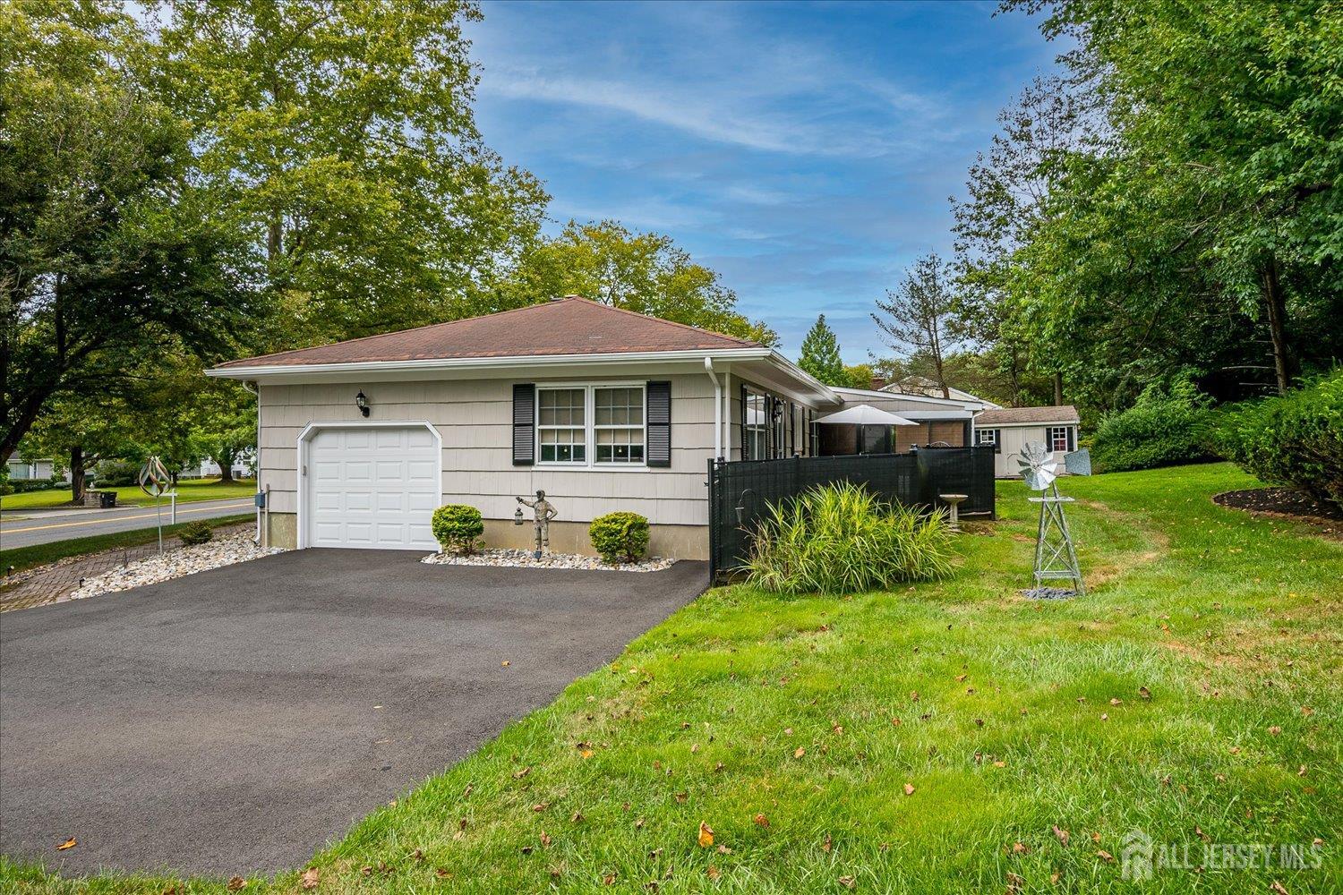 240 Dwight Road Middletown, NJ 07748 - Photo 9 of 28 a front view of a house with yard and green space