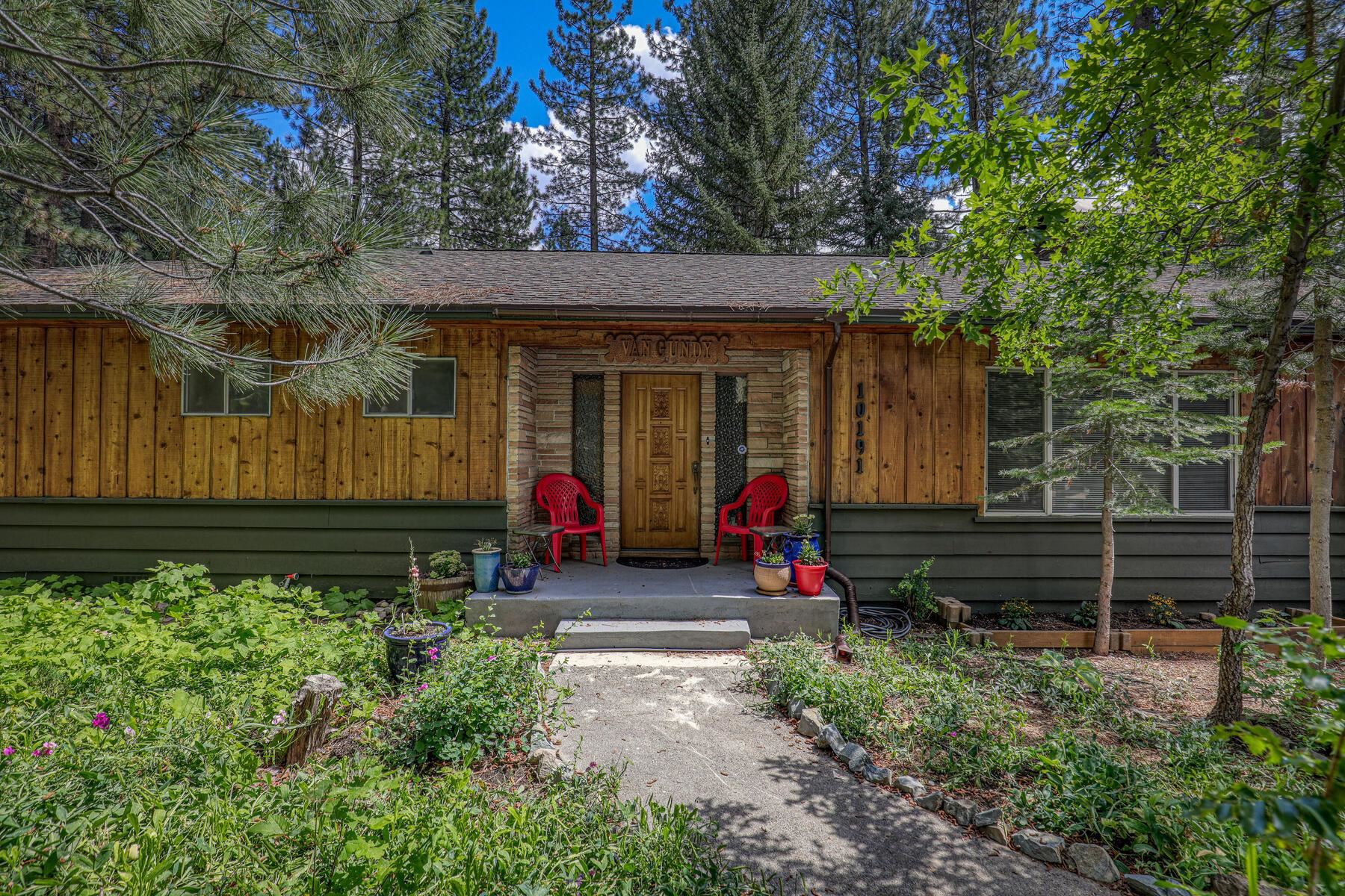 10191 Donner Trail Road Truckee, CA 96161 - Photo 1 of 21 a view of a house with a small yard and a large tree